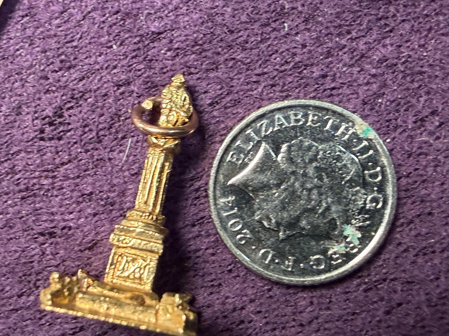 Nelson’s column 9 ct charm / a novel little keep sake from the city