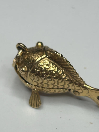9 ct ornate fish charm with a little man in a boat inside - unique piece