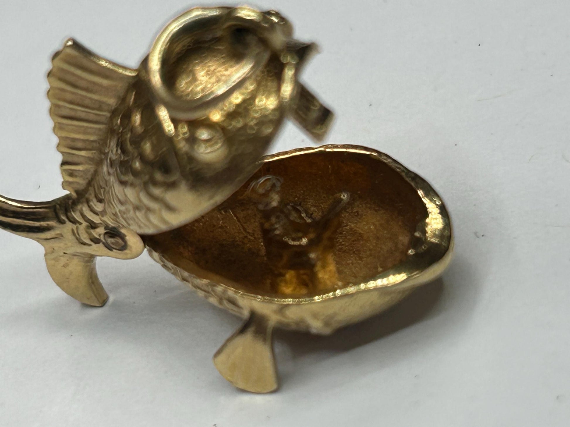 9 ct ornate fish charm with a little man in a boat inside - unique piece