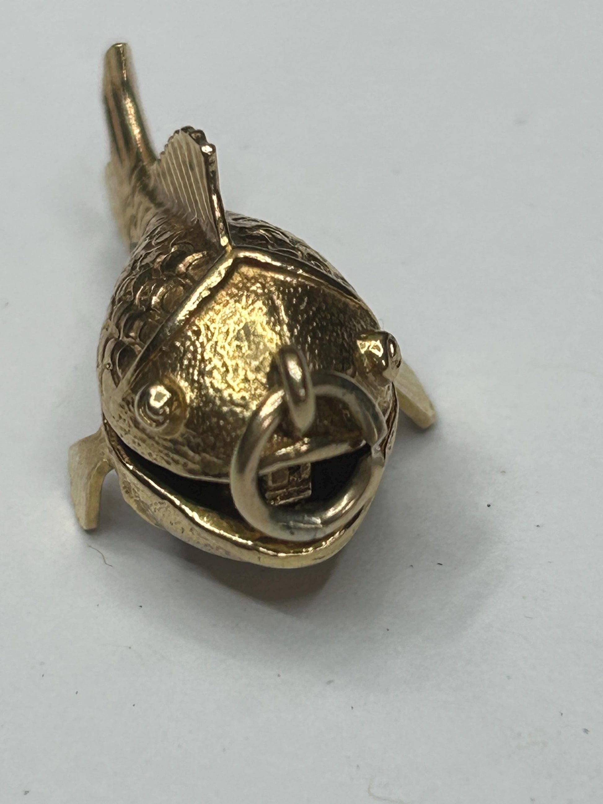 9 ct ornate fish charm with a little man in a boat inside - unique piece