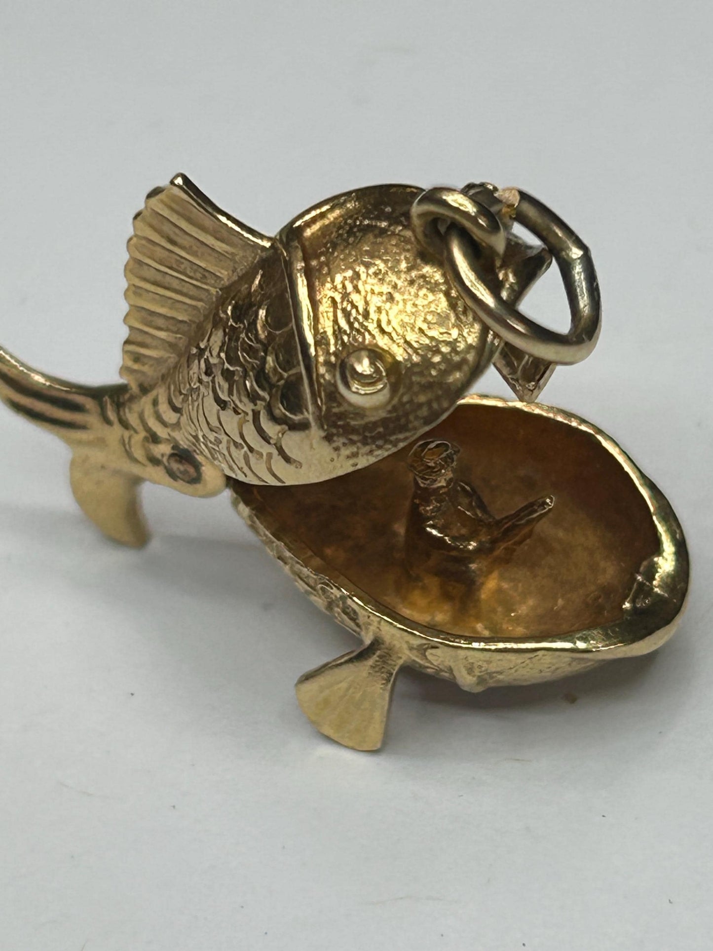 9 ct ornate fish charm with a little man in a boat inside - unique piece
