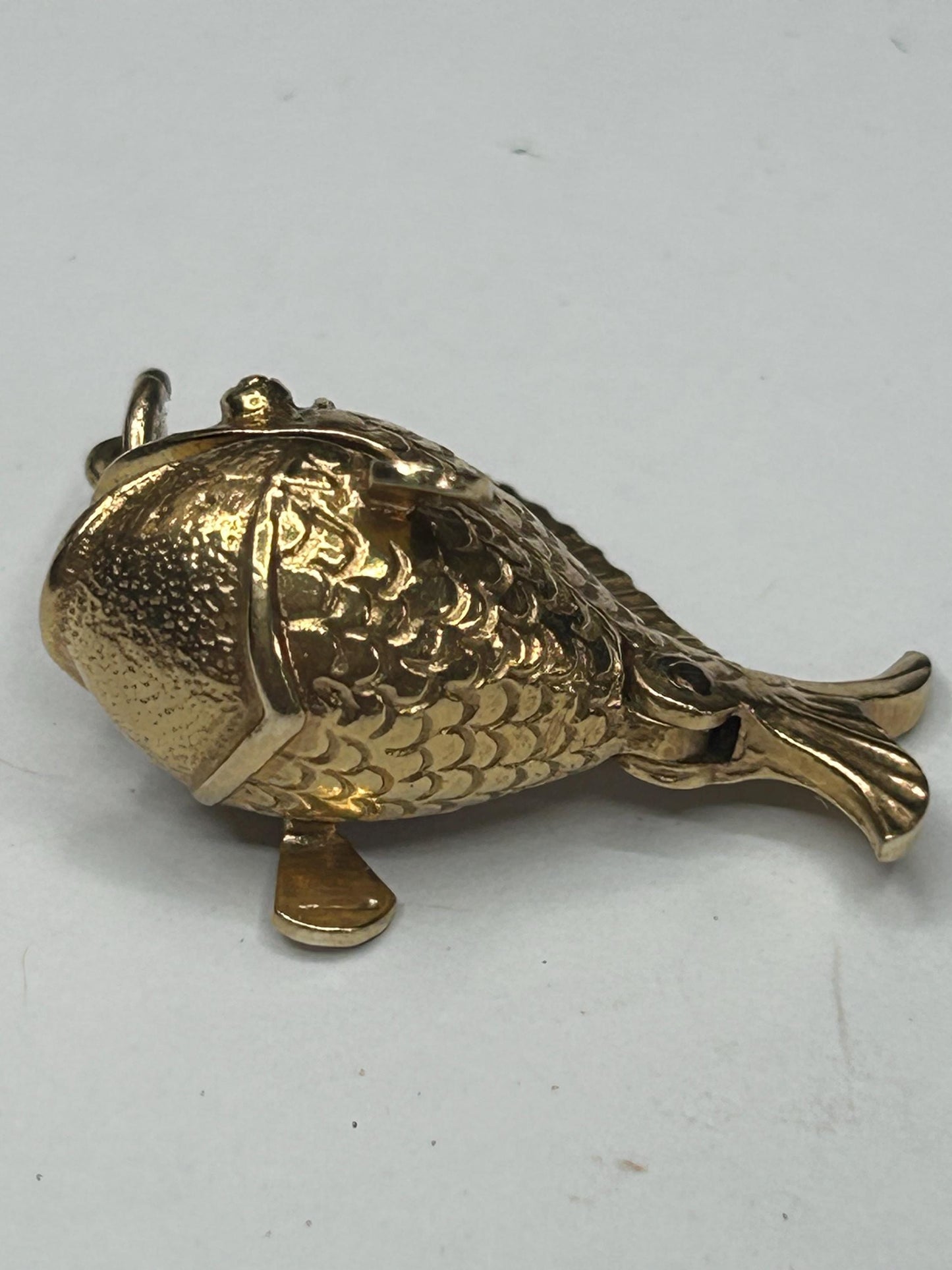 9 ct ornate fish charm with a little man in a boat inside - unique piece