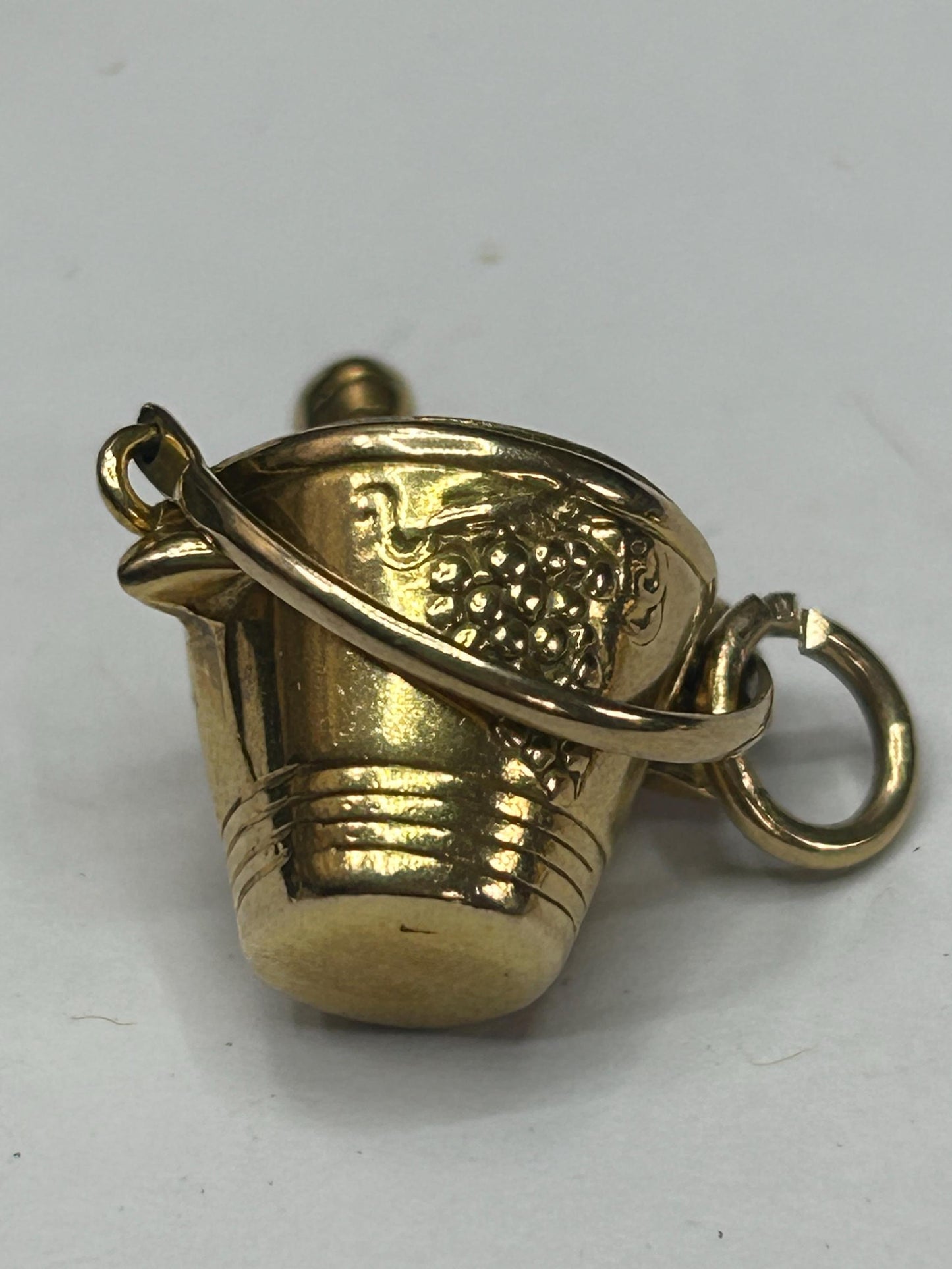 gold champagne bottle in bucket nicely engraved with grapes both sides