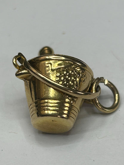 gold champagne bottle in bucket nicely engraved with grapes both sides