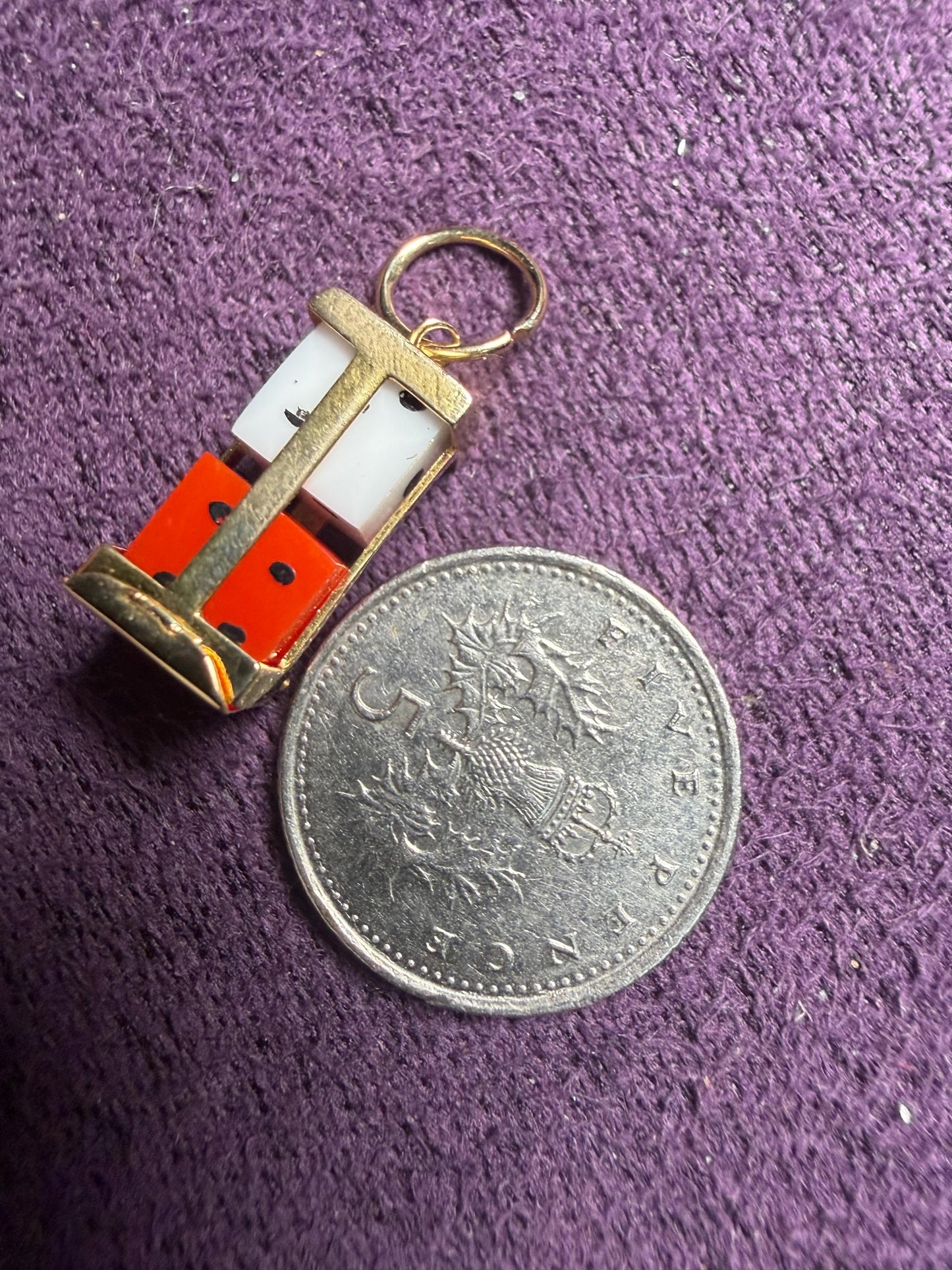 Dice Holder - dated 1989 . Nice outer case in 9 ct gold hold two dice one white one red - the case hinges open at the bar so 