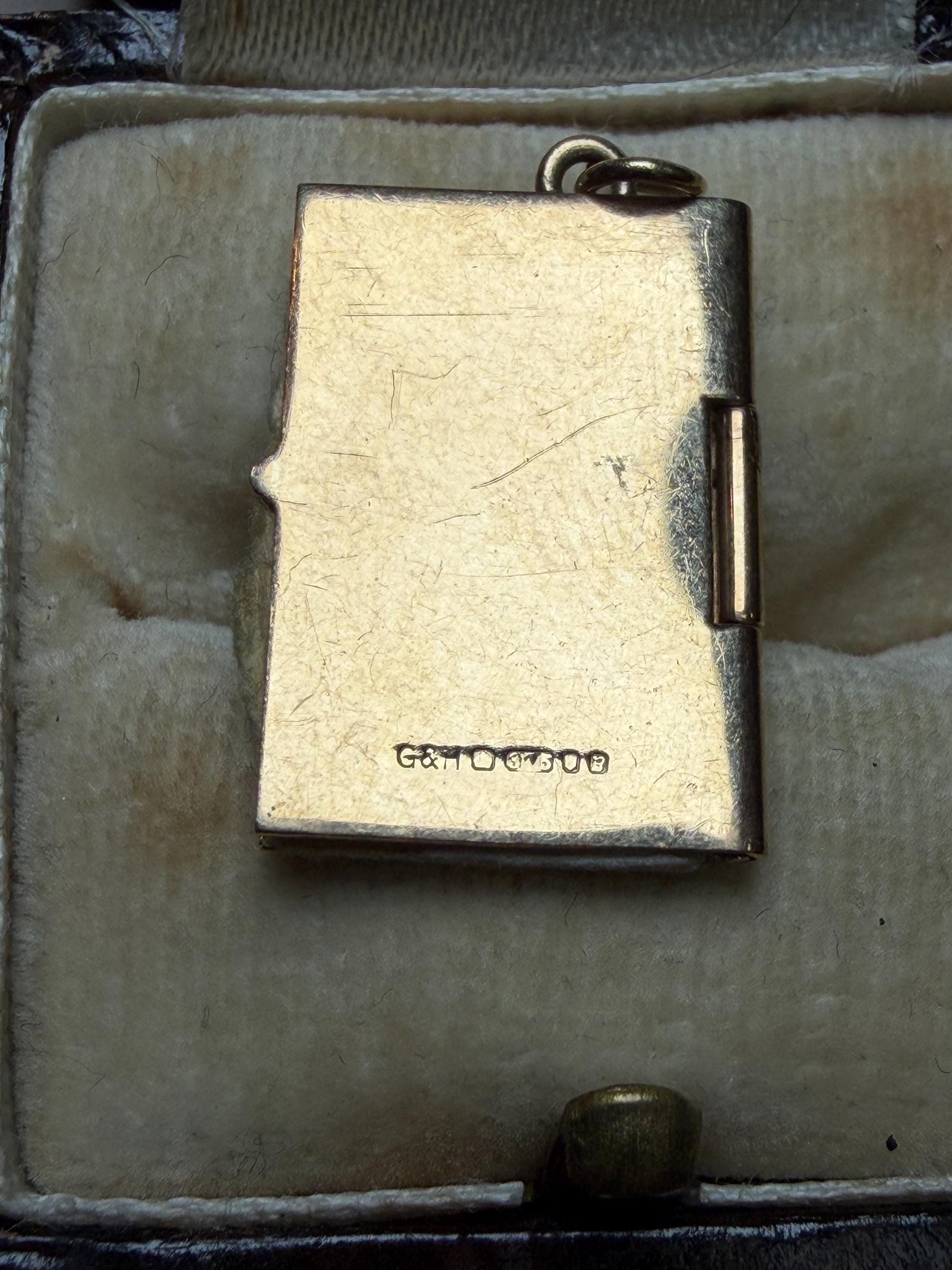 9 ct driving licence charm in really good condition for age - fully opens with papers inside .