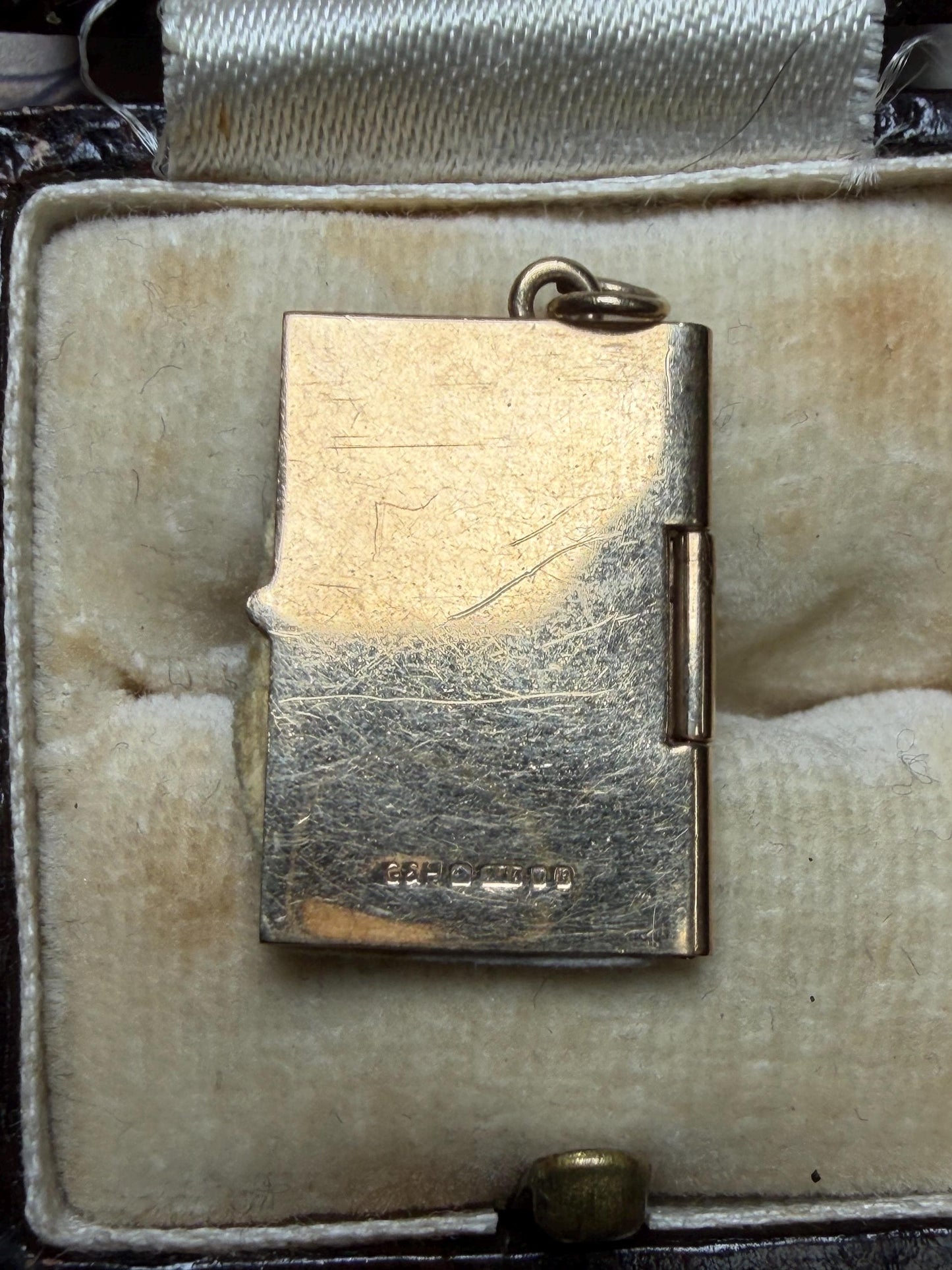 9 ct driving licence charm in really good condition for age - fully opens with papers inside .