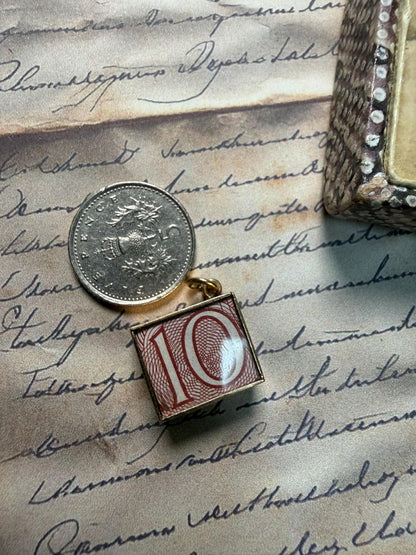 An old 10 pound note in a cute gold box