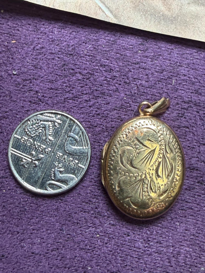 9 ct gold oval pendant beautifully engraved - quite big