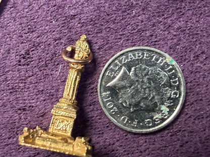 Nelson’s column 9 ct charm / a novel little keep sake from the city